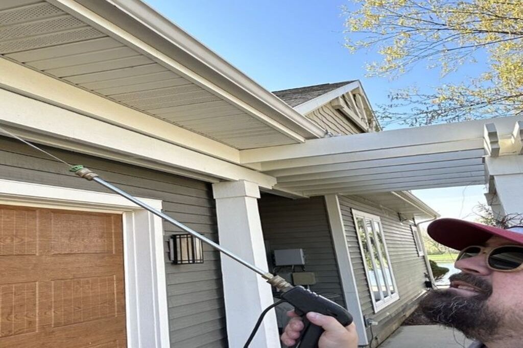 DeadOne technician treating the eaves of a Fort Wayne home